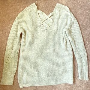 Green hued semi hi-low cross back sweater